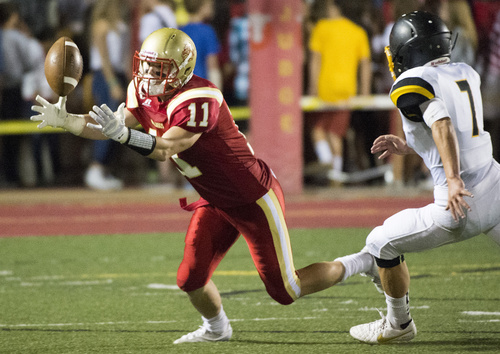 Rick Egan  |  The Salt Lake Tribune

Braden Pelly (11) Judge Memorial, hauls in a pass, as Zach Roll (7) defends for Union, in prep football action at Judge Memorial, Friday, September 19, 2014