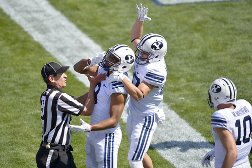 Chris Detrick  |  The Salt Lake Tribune
Brigham Young Cougars wide receiver Jordan Leslie (9) celebrates his touchdown with Brigham Young Cougars wide receiver Mitchell Juergens (87) during the game at LaVell Edwards Stadium Saturday September 20, 2014.  Virginia is winning the game 16-13 at halftime.