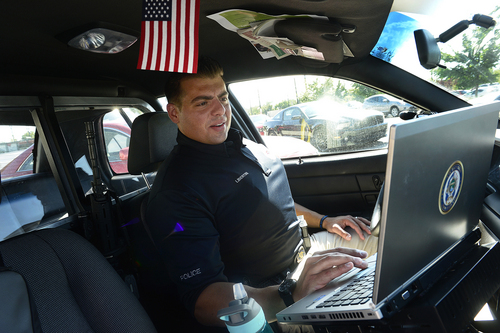Scott Sommerdorf   |  The Salt Lake Tribune
West Valley City police officer Franco Libertini about to go out on patrol, Wednesday, September 10, 2014.