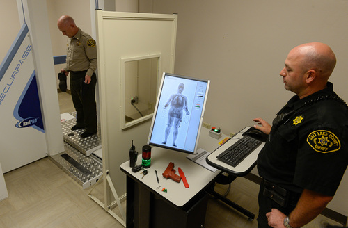 Francisco Kjolseth  |  The Salt Lake Tribune
The Salt Lake County Sheriff's Office announces the implementation of a new system to detect contraband as Lt. Dave Hall, steps in to demonstrate while officer Mark Hintze brings up his image. The SecurPASS Whole Body Contraband Detection System uses "transmission imaging" technology that is less intrusive because it does not show facial features or private body parts.