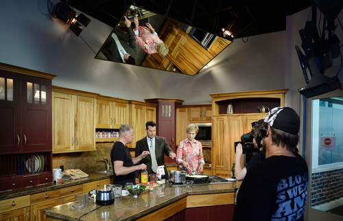 Steve Griffin  |  The Salt Lake Tribune

Anchors Ron Bird and Mary Nickles join chef Bryan Woolley as he shows viewers how to make onion jam during the noon cooking segment on KUTV Ch. 2 in Salt Lake City on Friday, Sept. 19, 2014. Woolley, a native of Idaho and a graduate of USU, has been doing a TV cooking show consecutively for some 20 years, one of the longest records in the country.