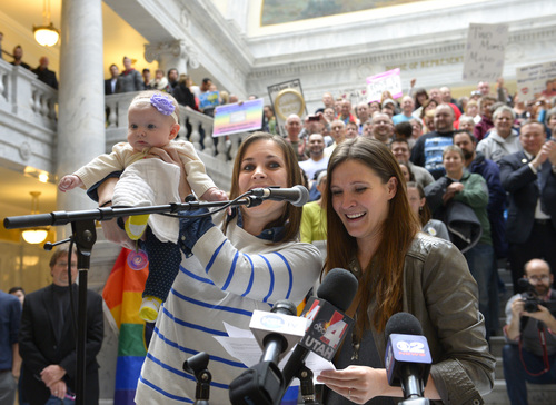 Rick Egan  | The Salt Lake Tribune 

Megan Barret and Candice Berrett hold their baby, Quinn, as they speak at a rally at the State Capitol, urging Gov. Herbert, to not appeal Judge Robert J. Shelby's ruling, Friday, January 10, 2014.