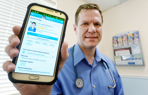 Steve Griffin  |  The Salt Lake Tribune

Dr. Layne Hermansen is one of the Utah doctors who have signed up for ZocDoc, an online service that allows patients to find open appointments at nearby doctors free of charge. ZocDoc is already in 40 states and 2,000 cities. Doctors pay $300 a month to be listed, and are able to fill holes in their schedules and find new patients. Here Dr. Hermansen holds his phone with the ZocDoc app at his Draper, Utah offices Monday, September 22, 2014.