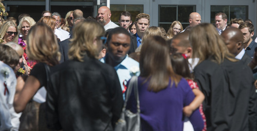 Steve Griffin  |  The Salt Lake Tribune

Family and friends watch as pallbearers carry the casket of Darrien Hunt following funeral services at the Saratoga Springs North Stake Center in Saratoga Springs, Utah Thursday, Sept. 18, 2014. Police officers in Saratoga Springs shot and killed Hunt on Sept. 10, 2014.