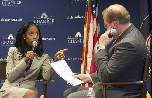 Rick Egan  |  The Salt Lake Tribune

Justin Jones (right) listens as Mia Love answers questions, at the Salt Lake Chamber of Commerce, Thursday, September 25, 2014.  Love declined to participate in a joint event and asked to appear first.