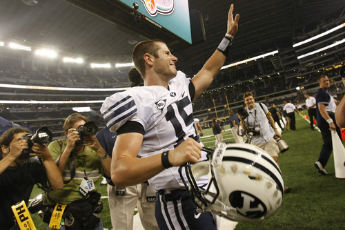 Brigham Young's Max Hall #15 waves to the crowd as he walks off of the field after the game against Oklahoma at Cowboys Stadium Saturday September 5, 2009. BYU won the game 14-13

Photo by Chris Detrick/The Salt Lake Tribune