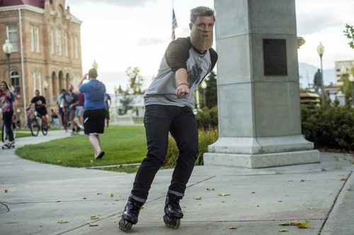 Chris Detrick  |  The Salt Lake Tribune
Beard supporters and enthusiasts rollerbalde from Provo City Library to Brigham Young University during a "bike for beards" rally Friday September 26, 2014.  Shane Pittson is petitioning school officials for the right to bear a beard. The university's honor code -- its mandatory contract that forbids premarital sex, drinking alcohol and tattoos, among other things -- outlaws any scruff on campus.