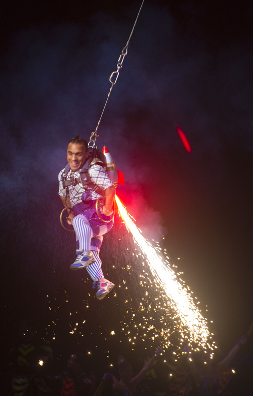 Steve Griffin  |  The Salt Lake Tribune

An acrobat suspended from a wire sails through the air as fireworks shoot from his back during opening night of the Ringling Bros. Barnum & Bailey Circus in Salt Lake City, Wednesday, September 24, 2014.