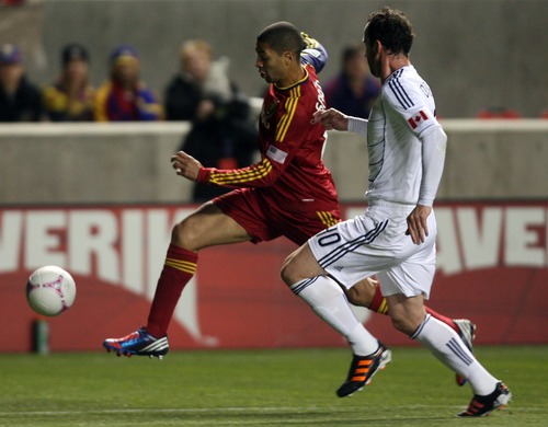 Kim Raff | The Salt Lake Tribune
(left) Real Salt Lake forward Alvaro Saborio (15) dribbles down field as he is defended by Vancouver FC Defender Andy O'Brien during a game at Rio Tinto Stadium in Sandy, Utah on October 27, 2012.