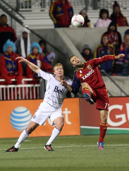 Kim Raff | The Salt Lake Tribune
(right) Real Salt Lake defender Chris Wingert (17) tries to get a head on the ball with Vancouver FC midfielder Barry Robson (14) during a regular season game at Rio Tinto Stadium in Sandy, Utah on October 27, 2012.