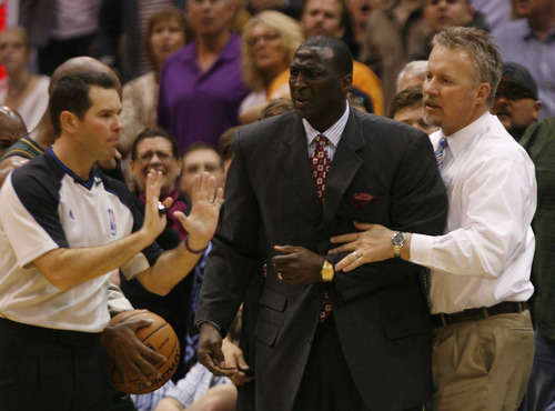 Rick Egan  | The Salt Lake Tribune 

Utah Jazz President/CEO Greg Miller, restrains Utah Jazz head coach Tyrone Corbin reacts to a call by the referee, late in the game, in NBA action,  Utah defeated Denver 105-103 in Salt Lake City, Monday, November 26, 2012.