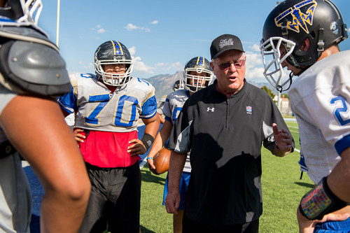 Trent Nelson  |  The Salt Lake Tribune
Former Utah and Weber football coach Ron McBride works with the Taylorsville High School football team Tuesday September 16, 2014 in Taylorsville.
McBride works with former players and assistants who are now high school coaches to help them with their teams.
