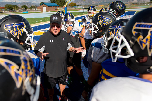 Trent Nelson  |  The Salt Lake Tribune
Former Utah and Weber football coach Ron McBride works with the Taylorsville High School football team Tuesday September 16, 2014 in Taylorsville.
McBride works with former players and assistants who are now high school coaches to help them with their teams.