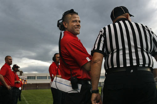 Scott Sommerdorf   |  The Salt Lake Tribune
Weber head coach Matt Hammer, smiles as he jokes with an official about a penalty call at West, Friday, August 23, 2013. Weber won 27-7 and snapped a 23-game losing streak.