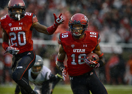 Scott Sommerdorf   |  The Salt Lake Tribune
Utah DB Eric Rowe glides into the end zone with an interception to give Utah a very quick 7-0 lead. Utah took a 21-0 lead over Washington State in the first quarter, Saturday, September 27, 2014. Team mate Marcus Williams celebtrates at left.
