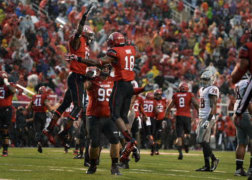 Scott Sommerdorf   |  The Salt Lake Tribune
A stunned Darius Lemora of Washiongton State looks as Utah celebrates Eric Rowe's INT return for a TD to give Utah a very quick 7-0 lead. Utah took a 21-0 lead over Washington State in the first quarter, Saturday, September 27, 2014.