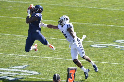 Chris Detrick  |  The Salt Lake Tribune
Virginia Cavaliers wide receiver Miles Gooch (17) makes a catch past Brigham Young Cougars defensive back Robertson Daniel (4) during the game at LaVell Edwards Stadium Saturday September 20, 2014.  Virginia is winning the game 16-13 at halftime.