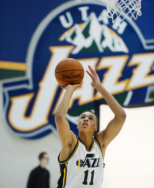 Steve Griffin  |  The Salt Lake Tribune


Jazz rookie Dante Exum shoots the ball during Jazz Media Day at the Zions Bank Basketball Center in Salt Lake City, Monday, September 29, 2014.