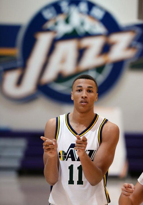 Steve Griffin  |  The Salt Lake Tribune


Jazz rookie Dante Exum gets directed to his next interview during Jazz Media Day at the Zions Bank Basketball Center in Salt Lake City, Monday, September 29, 2014.