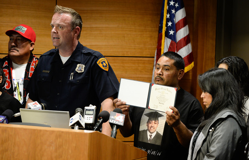 Francisco Kjolseth  |  The Salt Lake Tribune
Salt Lake Police Detective Cody Lougy, alongside the parents of 18-year-old homicide victim Gustavo Jarquin, make a public plea for information in their son's case during a press conference at the Salt Lake City Public Safety Building on Wed. 1, 2014. On Sept. 18, the body of Gustavo Jarquin, 18, was found by a pedestrian who was walking to the Acapulco market, near Indiana Avenue (900 South) and Pueblo Street (140 West) about 7:30 a.m. Medical examiners concluded he died of a gunshot wound in what appeared to be a homicide.