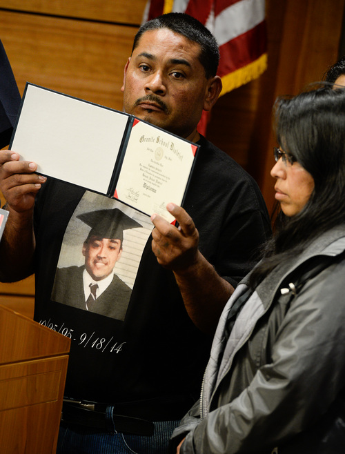 Francisco Kjolseth  |  The Salt Lake Tribune
The parents of 18-year-old homicide victim Gustavo Jarquin, Jose Luis Jarquin, holding his son's diploma, and Monica Gonzalez make a public plea for information in their sonís case during a press conference at the Salt Lake City Public Safety Building on Wed. 1, 2014. On Sept. 18, the body of Gustavo Jarquin, 18, was found by a pedestrian who was walking to the Acapulco market, near Indiana Avenue (900 South) and Pueblo Street (140 West) about 7:30 a.m. Medical examiners concluded he died of a gunshot wound in what appeared to be a homicide.