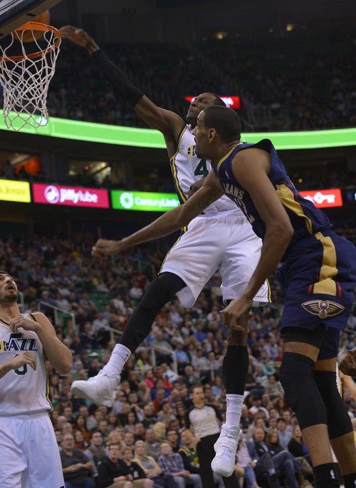 Leah Hogsten  |  The Salt Lake Tribune
Utah Jazz forward Jeremy Evans (40) with a monster dunk over New Orleans Pelicans center Alexis Ajinca (42) in the second half. The Utah Jazz defeated the New Orleans Pelicans 100-96 during their game Friday, April 4, 2014 at Energy Solutions Arena.