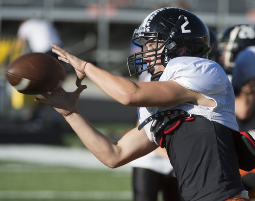 Rick Egan  |  The Salt Lake Tribune

Wide receiver Riley Richmond (2) grabs a pass during practice with the Murray High football team, Wednesday, September 24, 2014