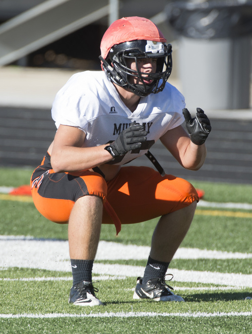 Rick Egan  |  The Salt Lake Tribune

Mason Burnett (22) runs drills during practice with the Murray High football team, Wednesday, September 24, 2014