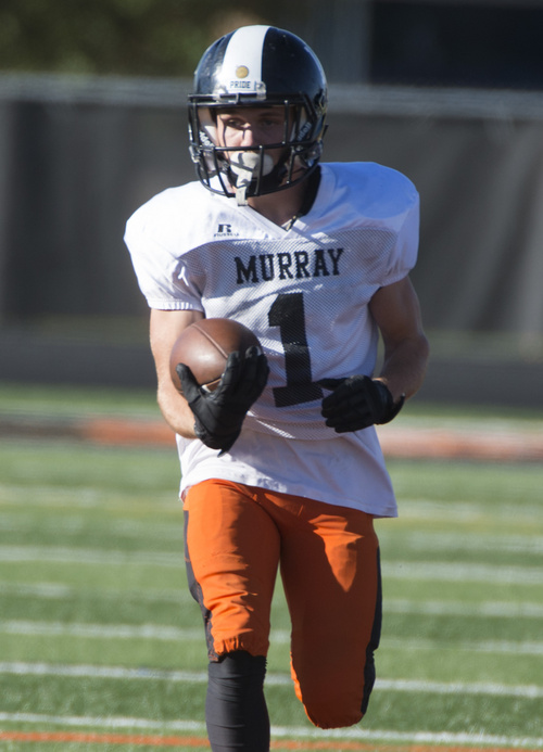 Rick Egan  |  The Salt Lake Tribune

Wide receiver Mitch Rasumssen runs with the ball during practice with the Murray High football team, Wednesday, September 24, 2014