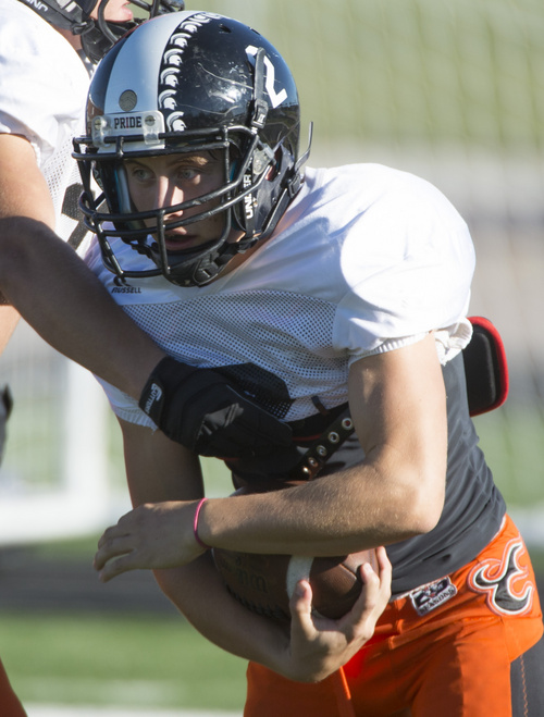 Rick Egan  |  The Salt Lake Tribune

Wide receiver Riley Richmond (2) runs with the ball during practice with the Murray High football team, Wednesday, September 24, 2014