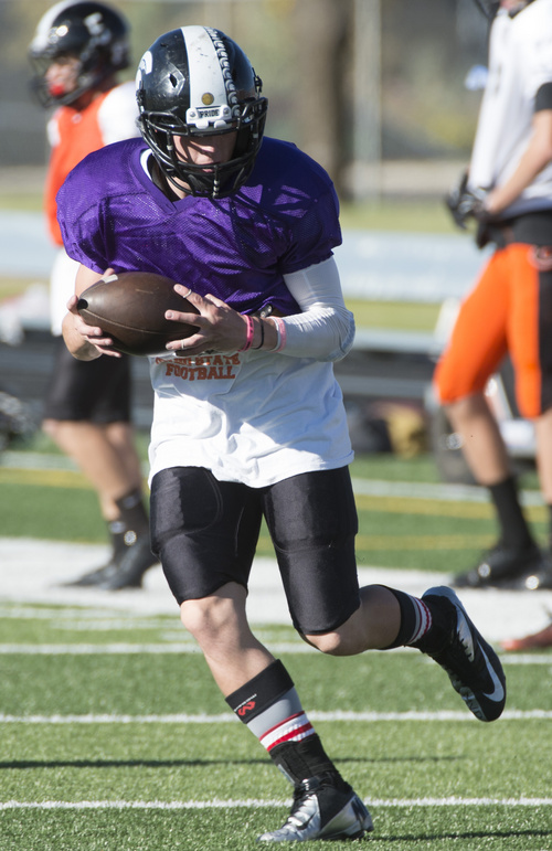 Rick Egan  |  The Salt Lake Tribune

Running back Taylor Litson (23) runs drills during practice with the Murray High football team, Wednesday, September 24, 2014