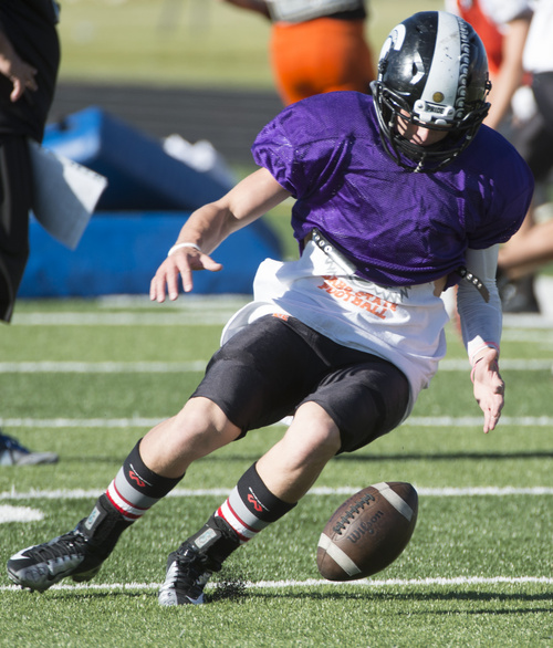 Rick Egan  |  The Salt Lake Tribune

Running back Taylor Litson (23) runs drills during practice with the Murray High football team, Wednesday, September 24, 2014