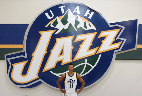 Steve Griffin  |  The Salt Lake Tribune


Jazz rookie Dante Exum stands below a giant Jazz logo during Jazz Media Day at the Zions Bank Basketball Center in Salt Lake City, Monday, September 29, 2014.