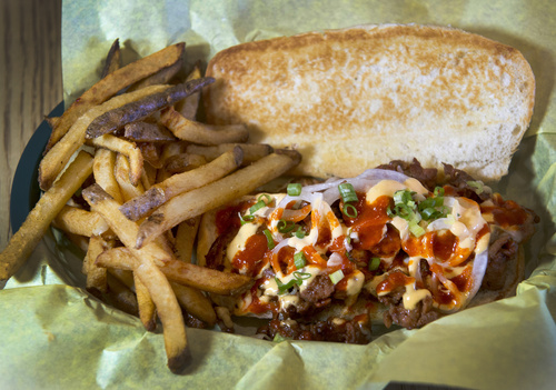 Rick Egan  |  The Salt Lake Tribune

 "KP-Spicy" a sandwich made with Korean spicy pork mozzarella, onions and jalapeno mayo, at Bumblebee's  BBQ & Grill in Midvale.
