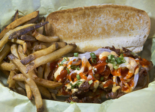 Rick Egan  |  The Salt Lake Tribune

 "KP-Spicy" a sandwich made with Korean spicy pork mozzarella, onions and jalapeno mayo, at Bumblebee's BBQ & Grill in Midvale.