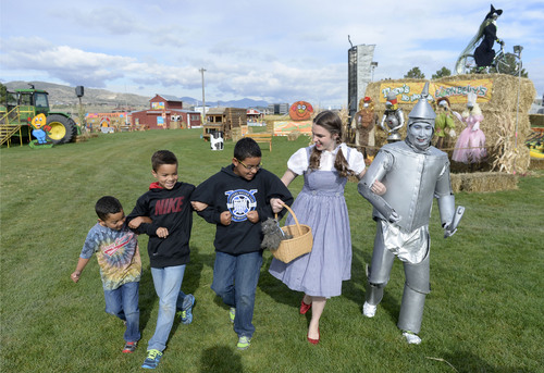 Al Hartmann  |  The Salt Lake Tribune
Brothers Wesley, Daniel,  and Marcus Haston take a stroll around Cornbelly's Pumpkin Festival with "Dorothy and the "Tinman."  The state's original corn maze returns to Cornbelly's at Thanksgiving Point for its 19th season on Oct. 3. The 8-acre maze pays tribute to the 75th anniversary of the "Wizard of Oz" movie