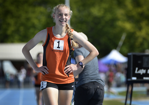 Scott Sommerdorf   |  The Salt Lake Tribune
Sarah Feeny of Ogden smiles after setting a state record in the 4A Girl's 3200 meters with a 10:13.86, beating the two year old record by 8 seconds, Saturday, May 17, 2014.
