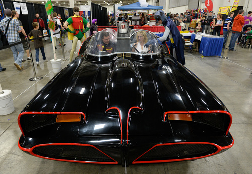 Franciso Kjolseth  |  The Salt Lake Tribune
Fans get a chance to sit in the 1966 Batmobile for a picture at the  Salt Palace Convention Center for day two of Salt Lake Comic Con's FanX.