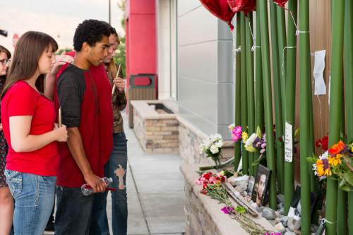Trent Nelson  |  The Salt Lake Tribune
Family and friends at a memorial to Darrien Hunt Sunday September 14, 2014 at the Saratoga Springs Panda Express, where Hunt was shot and killed by police.