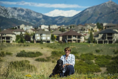 Chris Detrick  |  The Salt Lake Tribune
Christine McClory and her dog Tuffy pose for a portrait in Traverse Ridge Wednesday September 17, 2014.