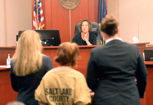 Al Hartmann  |  The Salt Lake Tribune
Alicia Englert, accused of throwing her baby in the trash earlier this month, makes her initial appearance in Judge Ann Boyden's courtroom in Salt Lake City Wednesday Septmeber 10.  Her defense lawyers Susanne Gustin, left, Melissa Fulkerson, right. She is charged with attempted murder.