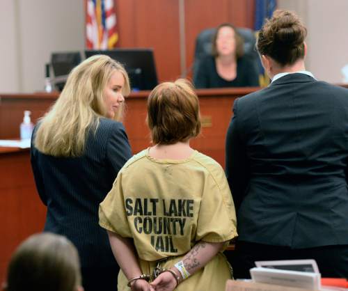 Al Hartmann  |  The Salt Lake Tribune
Alicia Englert, accused of throwing her baby in the trash earlier this month, makes her initial appearance in Judge Ann Boyden's courtroom in Salt Lake City Wednesday Septmeber 10.  Her defense lawyers Susanne Gustin, left, Melissa Fulkerson, right. She is charged with attempted murder.