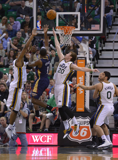Leah Hogsten  |  The Salt Lake Tribune
Utah Jazz center Derrick Favors (15)and Utah Jazz guard Gordon Hayward (20) are teaming up for defensive rebounds. The Utah Jazz are behind the New Orleans Pelicans 45-43 at the half of their game Friday, April 4, 2014 at Energy Solutions Arena.