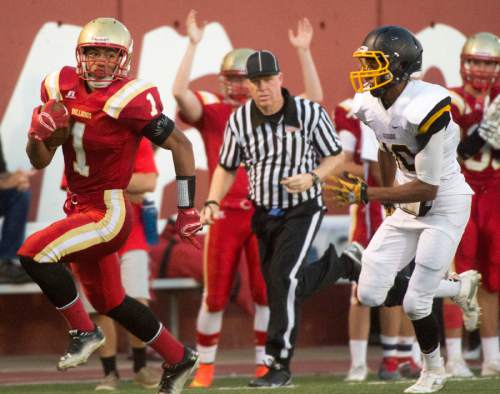 Rick Egan  |  The Salt Lake Tribune

Sport Falemaka (1) runs the ball for the Bulldogs, as Union's Everet Miller (10) chases him down, in prep football action, Judge Memorial vs. Union High School, at Judge Memorial, Friday, September 19, 2014