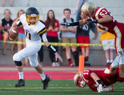 Rick Egan  |  The Salt Lake Tribune

Union QB The Winterton runs the ball for the Cougars, in prep football action, Judge Memorial vs. Union High School, at Judge Memorial, Friday, September 19, 2014