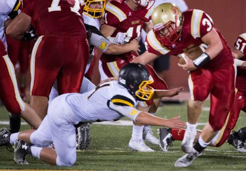 Rick Egan  |  The Salt Lake Tribune

Max Barnett (34) runs for the Bulldogs, in prep football action Judge Memorial vs. Union High School, at Judge Memorial, Friday, September 19, 2014