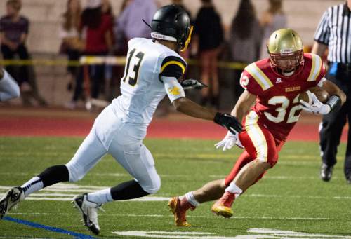 Rick Egan  |  The Salt Lake Tribune

Union High's Henrique Morieira(13) chases down Michael Kearns (32) as he runs for Judge Memorial,  in prep football action Judge Memorial vs. Union High School, at Judge Memorial, Friday, September 19, 2014