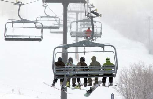 Francisco Kjolseth  |  The Salt Lake Tribune
Skiers and snowbaorders ride the Payday lift in Park City Mountain Resort.