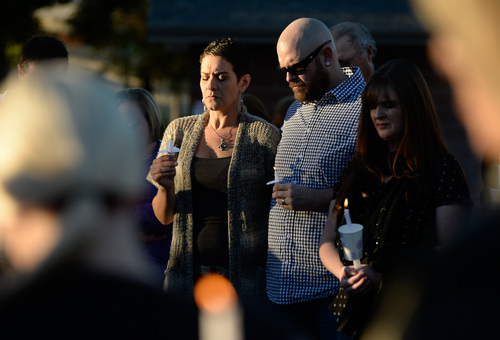 Francisco Kjolseth  |  The Salt Lake Tribune
Amanda and Ryeley Muir attend a vigil for their friends the Strack family at Pioneer Park in Provo after the family of five were mysteriously found dead in their Springville home last Saturday. A Springville Police news release identified them Sunday as Benjamin Strack, 37, his wife, Kristi Strack, 36, two of their sons -- Benson Strack, 14, and Zion Strack, 11 -- and their daughter Emery Strack, 12. Preliminary autopsies ruled out any sort of violent assault, according to the release.