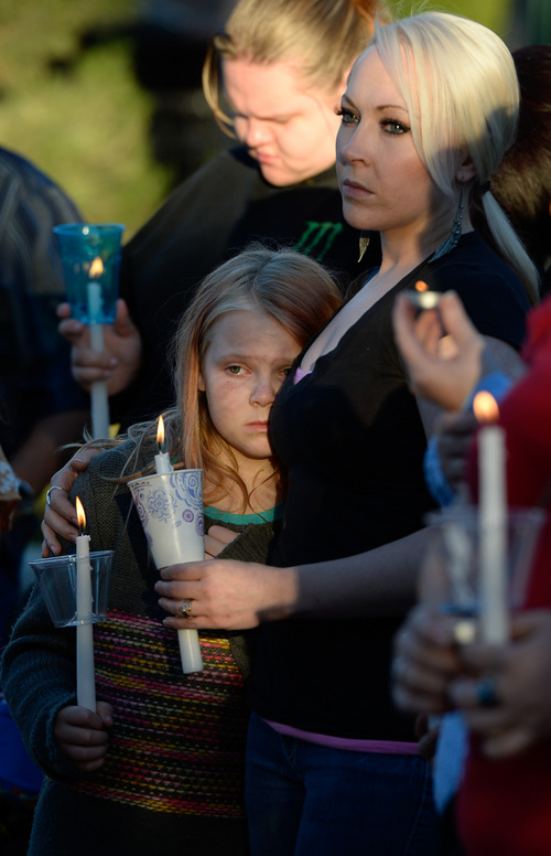 Francisco Kjolseth  |  The Salt Lake Tribune
Shantay Healey comforts her daughter Annika Younkin, 10, as they attend a vigil for their friends the Strack family at Pioneer Park in Provo after the family of five were mysteriously found dead in their Springville home last Saturday.